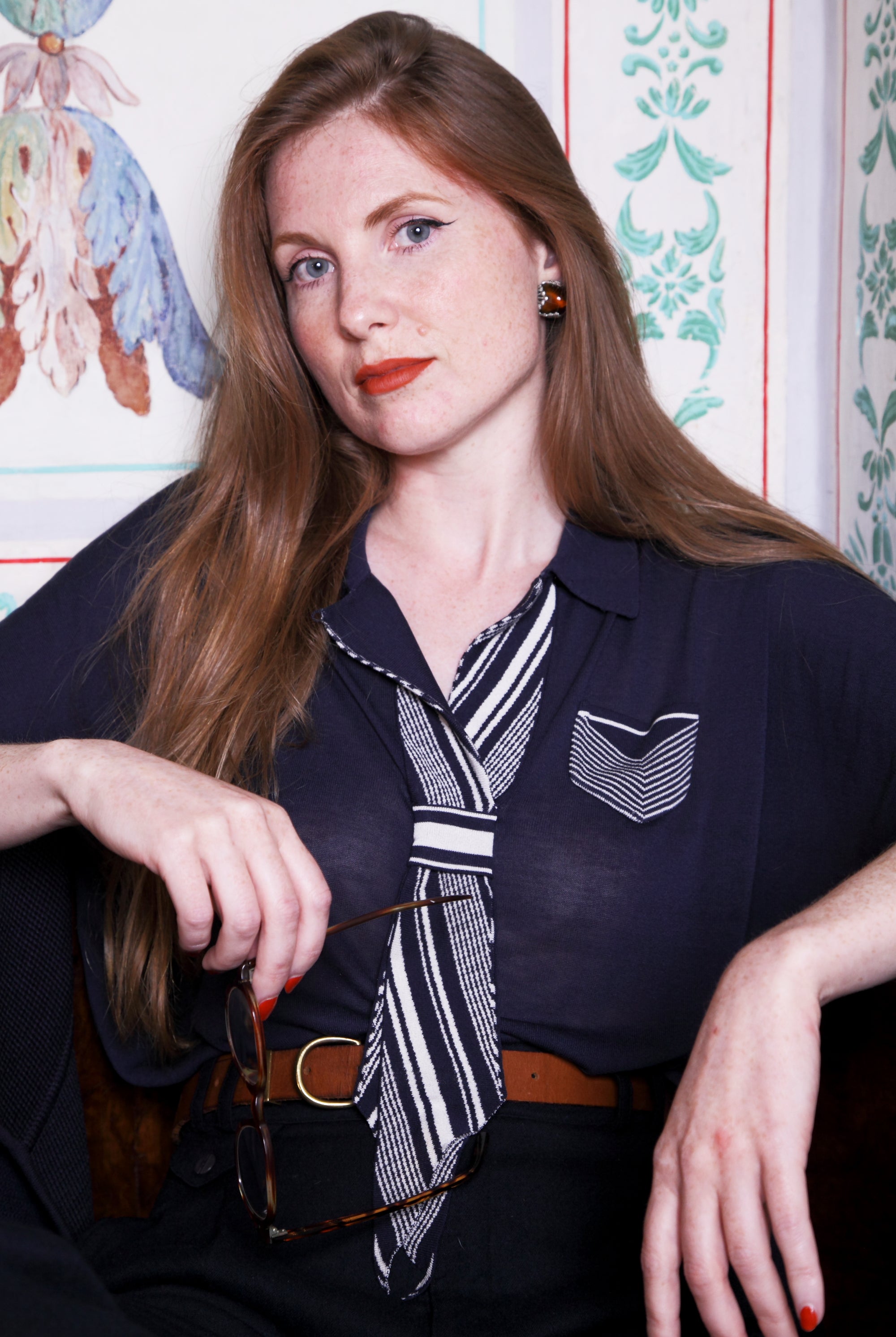 Combelle Eton Blouse navy front upper body showing tie detail with hands at waist