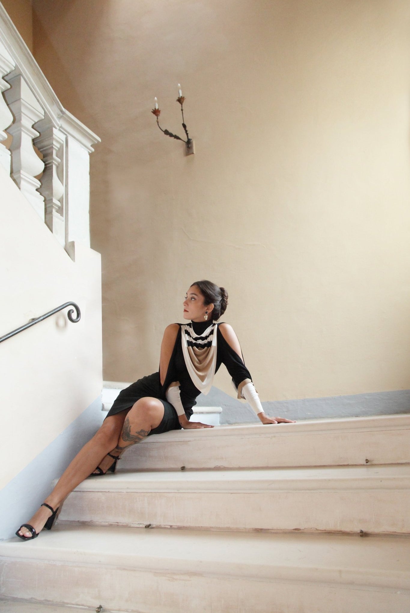 Combelle Elsa Top in black with Frida Foulard, full length body on staircase highlighting the exposed shoulders and foulard drape