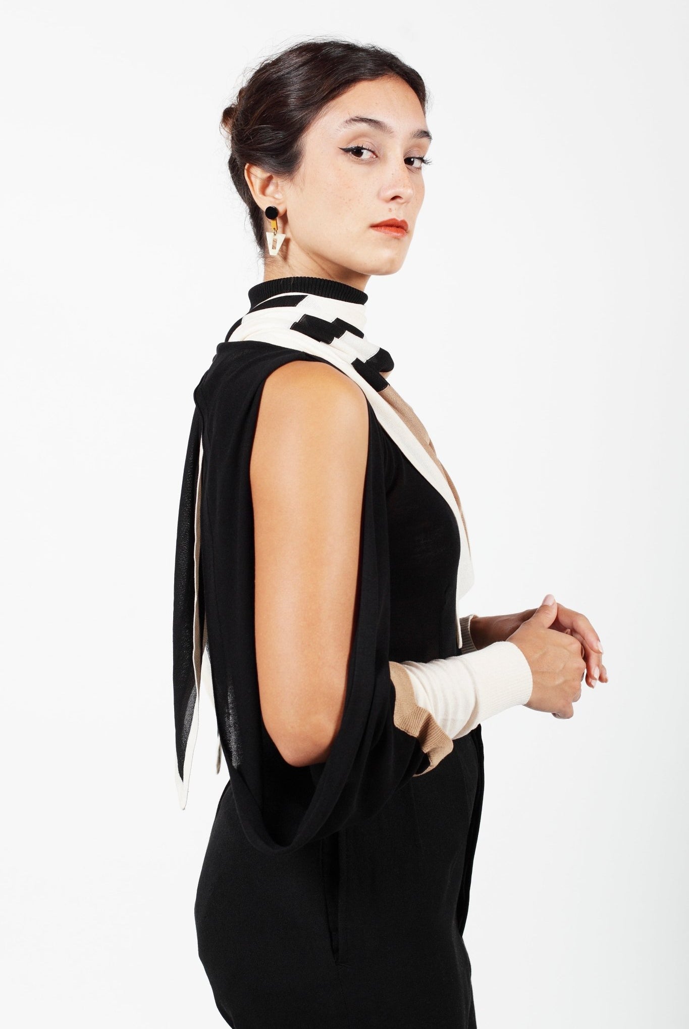 Combelle Elsa Top in black, side view with open shoulder exposed and rabbit ear ties and the Frida foulard pulled behind the collar for evening wear