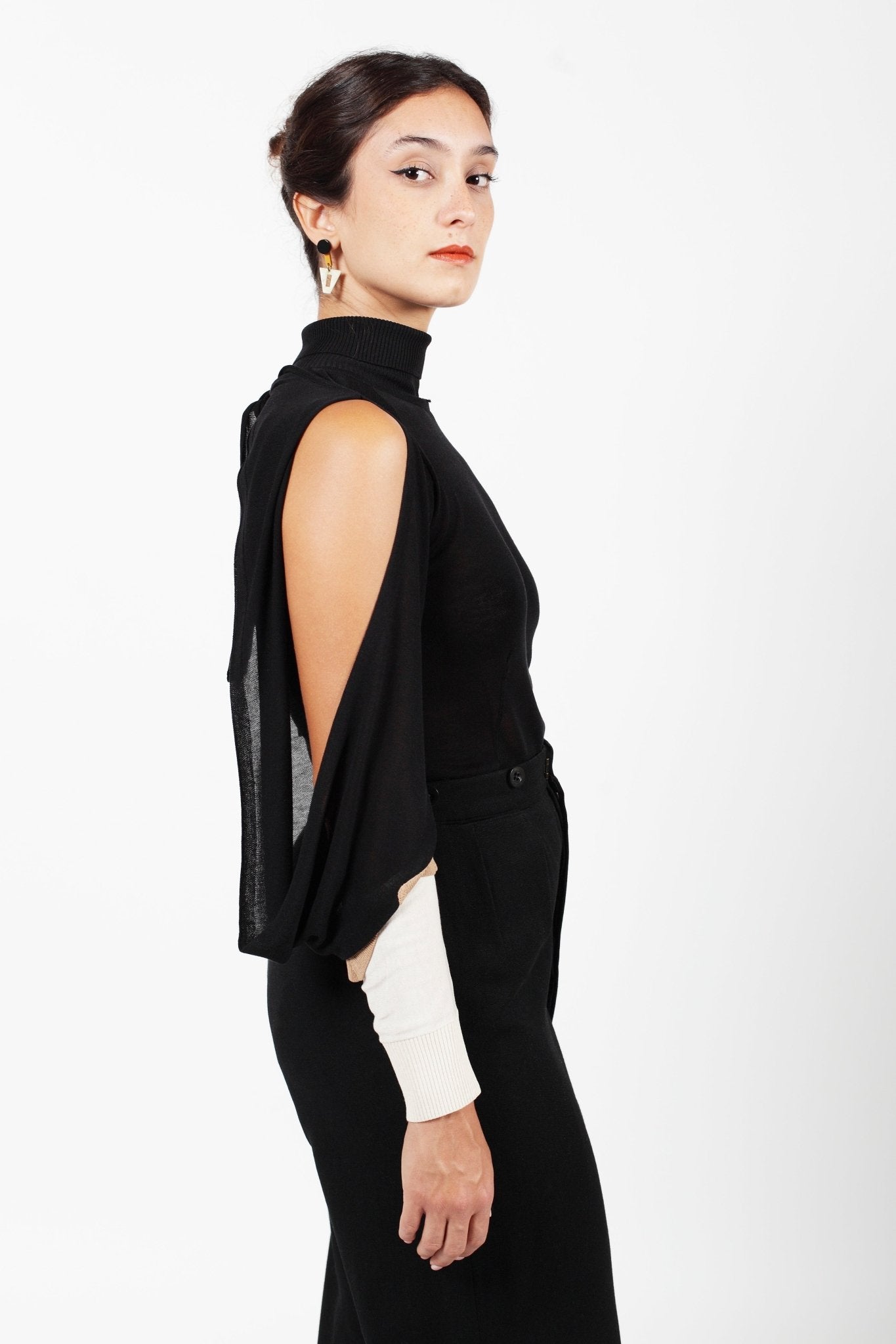 Combelle Elsa Top open drape sleeve detail showing the single-piece knitted envelope construction and exposed shoulder