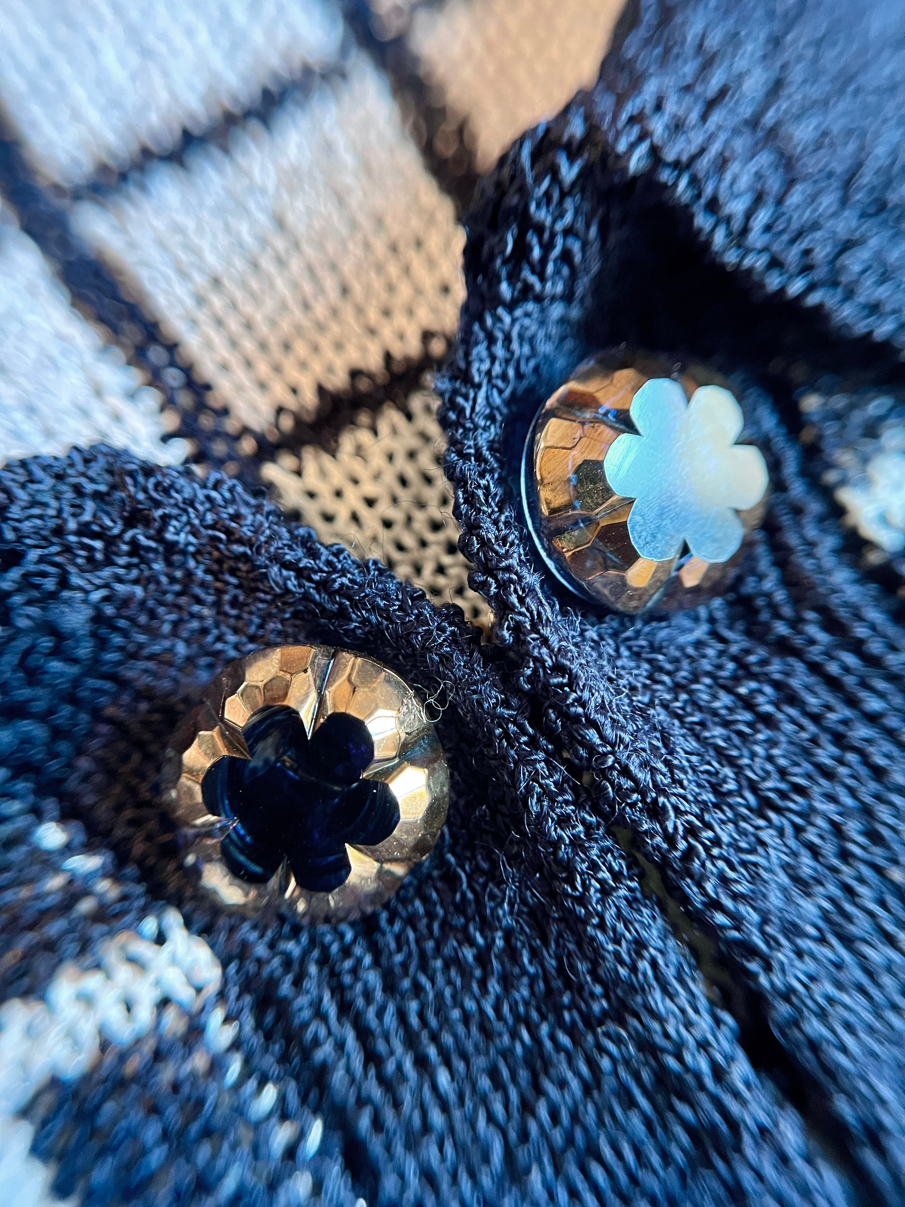 Combelle Madison Top navy hand-painted artisan glass evening button detail — removable cufflink-style buttons handmade in Munich, shown against the check knit