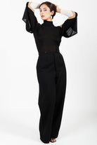 Combelle Elsa Top in black, full length front view showing the draped open sleeve falling from the shoulders