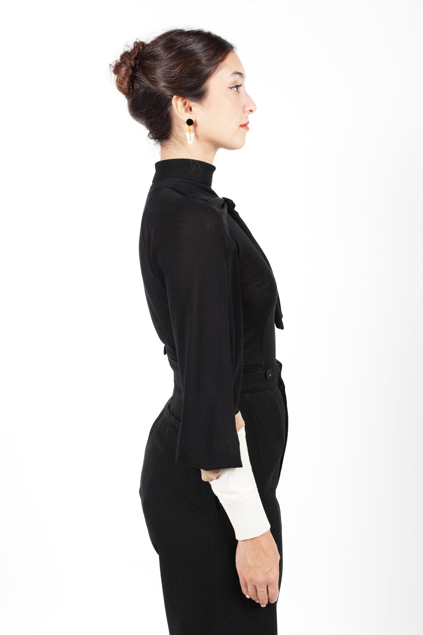 Combelle Elsa Top in black, side profile view showing the elegant line of the fitted body and open sleeve