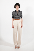 Combelle Madison Top in navy, full length front view showing the boxy adherent fit and check pattern, worn with cream wide-leg trousers