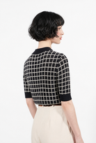 Combelle Madison Top in navy, three-quarter back view showing the check pattern and fitted boxy cut