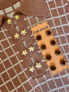 Combelle Madison Top tobacco colourway with both interchangeable button sets — daisy chain cufflink buttons for day and hand-painted artisan glass buttons for evening