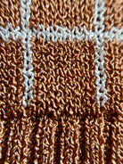 Combelle Madison Top in tobacco, extreme macro detail of the two-tone viscose check yarn showing the warm tobacco and stone construction and fabric texture