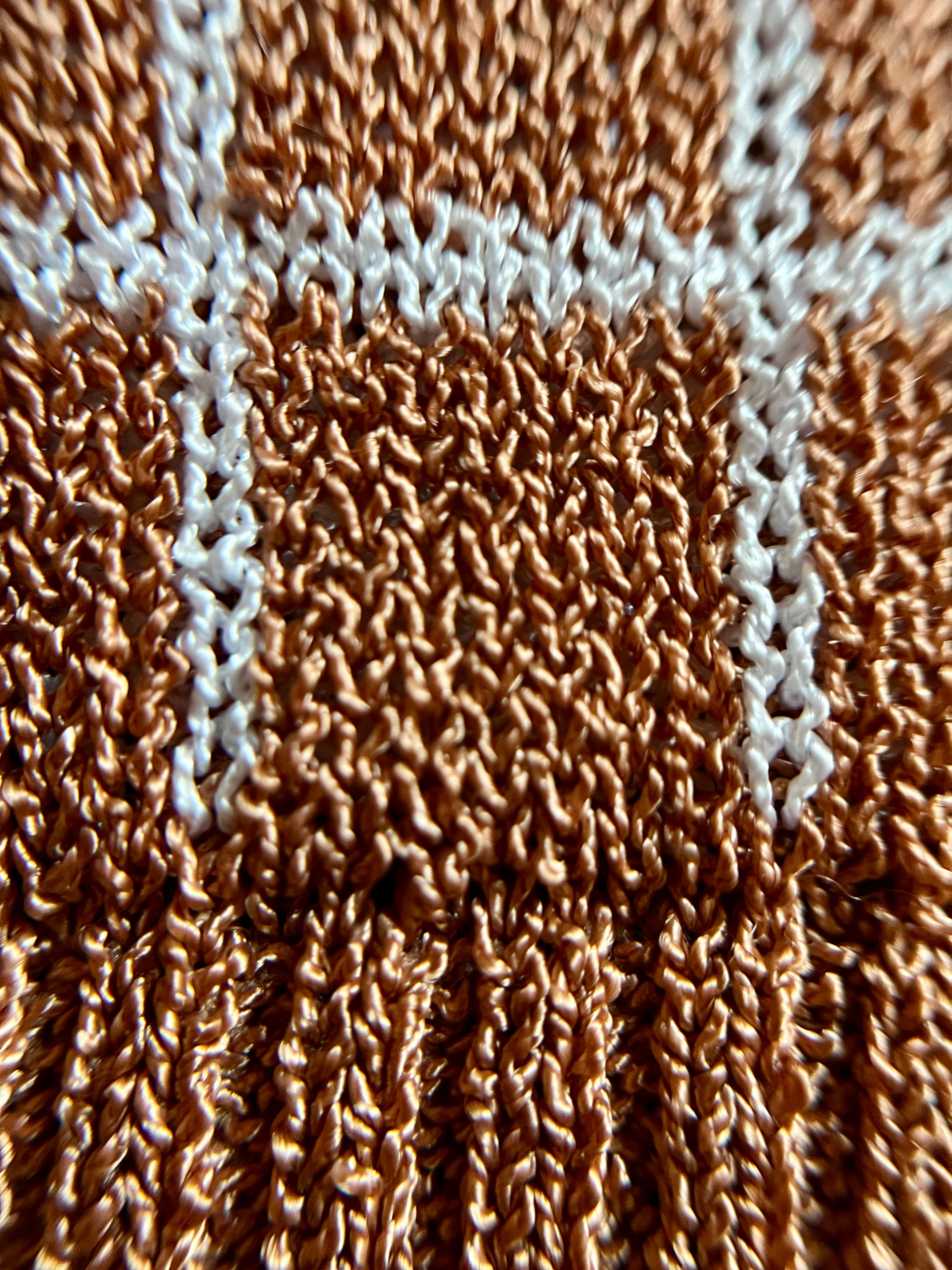 Combelle Madison Top in tobacco, extreme macro detail of the two-tone viscose check yarn showing the warm tobacco and stone construction and fabric texture