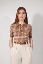 Combelle Madison Top in tobacco, full length straight front view showing the complete silhouette and daisy chain buttons against cream wide-leg trousers