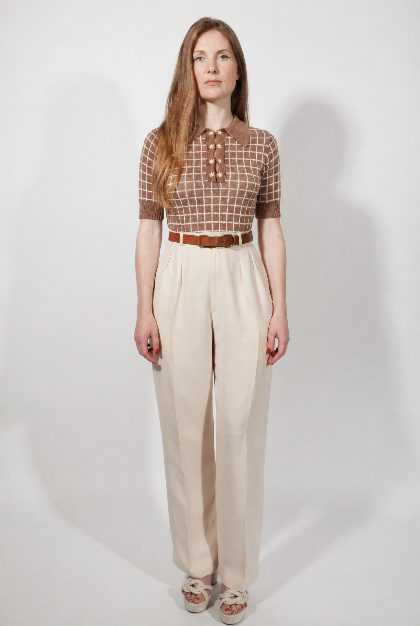 Combelle Madison Top in tobacco, full length straight front view showing the complete silhouette and daisy chain buttons against cream wide-leg trousers