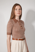 Combelle Madison Top in tobacco, full length front view showing the boxy adherent fit and warm check pattern, worn with cream wide-leg trousers and tan belt