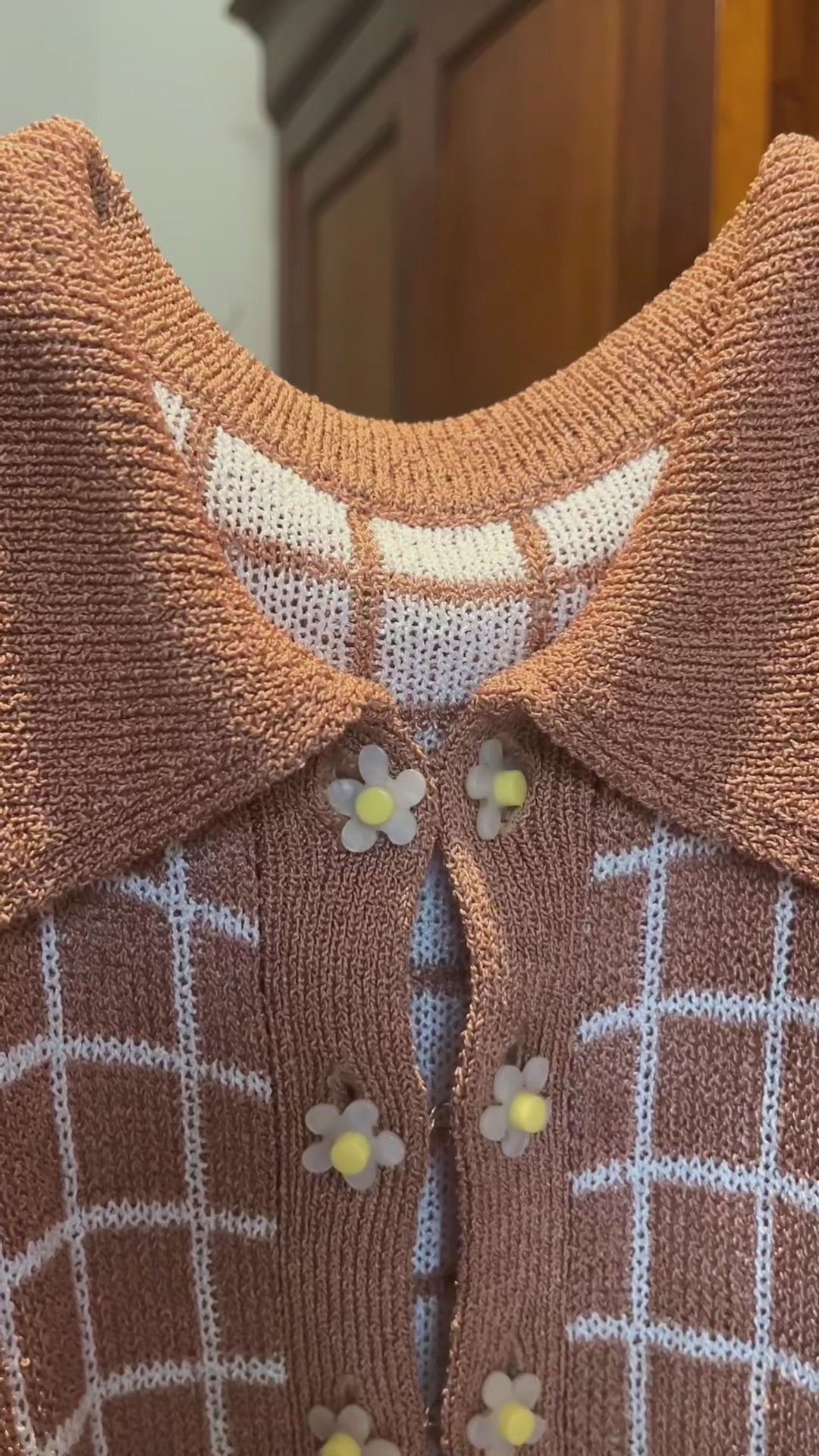 Combelle Madison Top daisy chain cufflink button detail video — close-up pan showing the removable daywear buttons across both tobacco and navy colourways